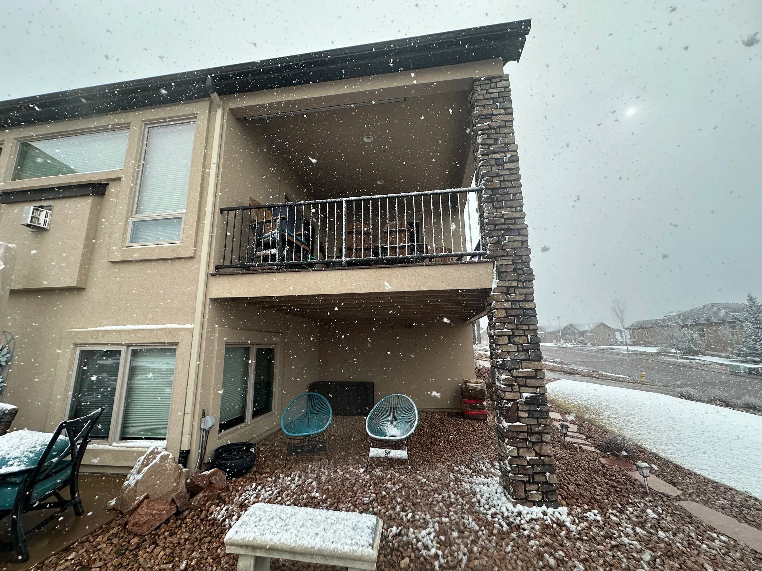 A CoCreate Construction home with custom stonework and a covered deck in Colorado Springs